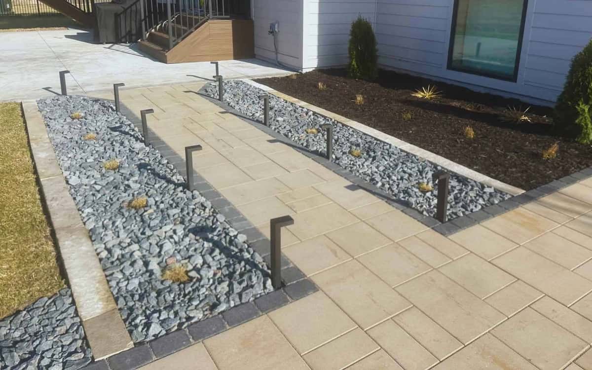 Paver walkway with retaining wall and bollard lighting